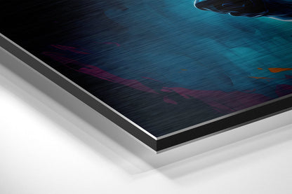 Close-up angled view of brushed aluminum dibond layers showing teal, dark blue, and burgundy abstract printed design with silver edge detail.