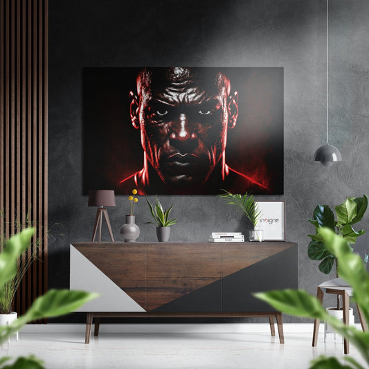 Red-lit portrait of intense boxer's face mounted above wooden console in modern gray interior with plants and pendant lamp.