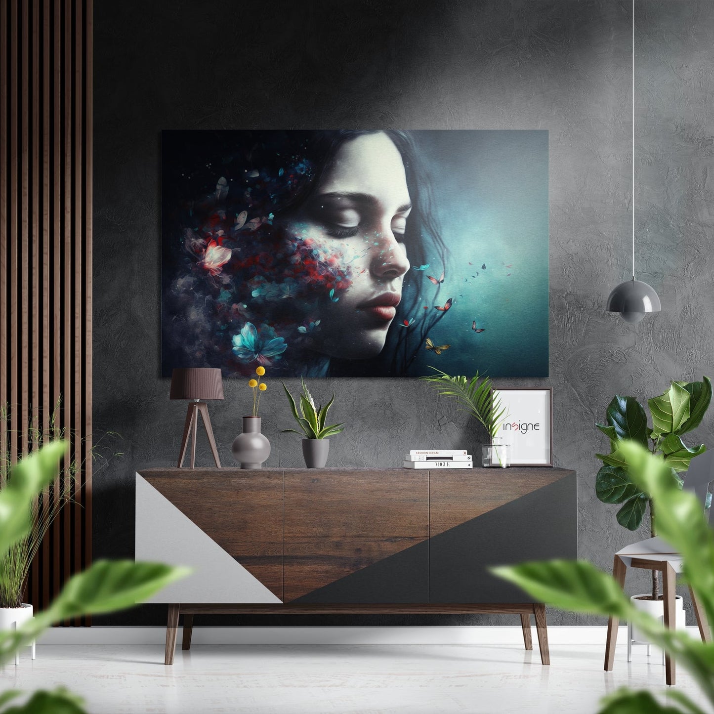 Modern interior with brushed aluminum wall art featuring woman's profile with colorful floral and butterfly dispersal effect.