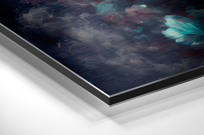 Angled perspective view of brushed aluminum Dibond wall art with dark blue abstract floral design and turquoise accents, showing layered edge construction.