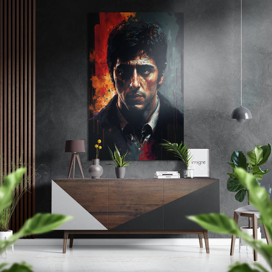 Red and teal portrait painting of man displayed above wooden console in modern interior with plants and pendant light.