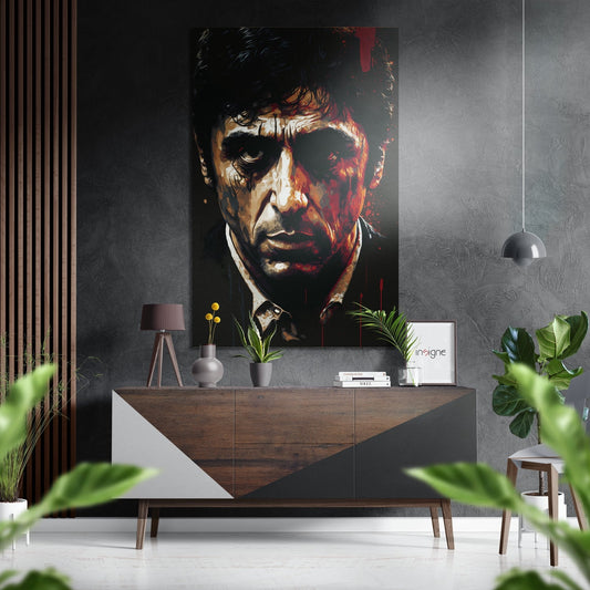 Modern interior featuring a dark portrait with red and cream tones mounted above a wooden dresser with potted plants and decor.