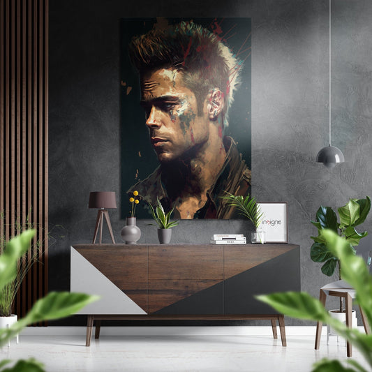 Portrait painting of man in profile with spiky hair and facial tattoos displayed above wooden dresser in modern interior.