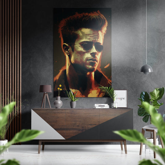 Modern interior with portrait of man wearing sunglasses and orange jacket displayed above wooden console table with plants and decor.