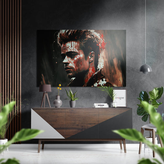 Modern living room displaying red and white paint splash portrait artwork above wooden console table with plants and decorative items.