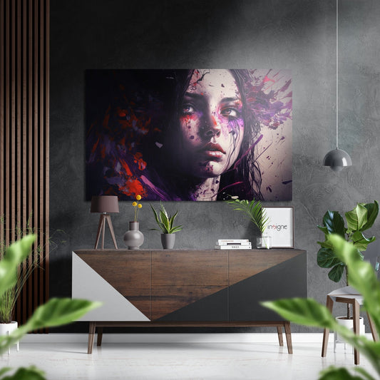 Modern interior featuring "The Girl" brushed aluminum wall art displaying a woman's face in purple and red tones above a wooden console table.