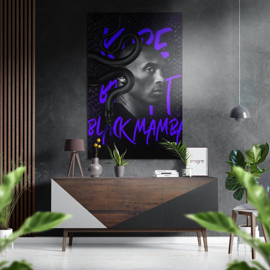Modern interior display showing black and white portrait with purple neon snake and graffiti text on wall above wooden console.
