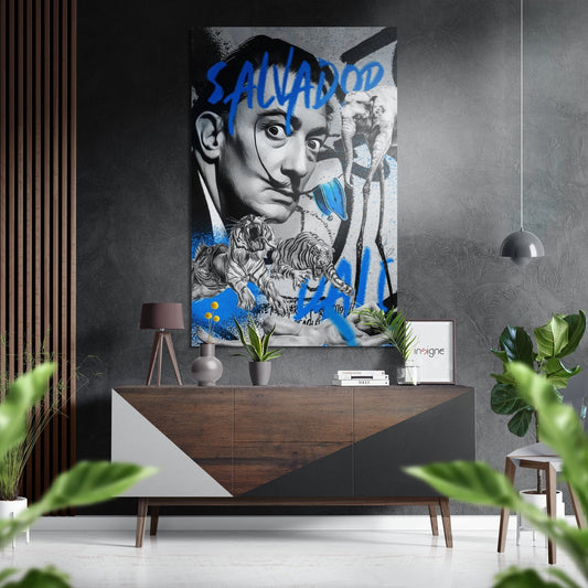 Modern living room interior featuring blue graffiti tiger collage portrait on gray wall above wooden console table with plants and pendant lamp.