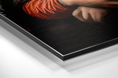 Close-up angled view of brushed aluminum Dibond wall art showing layered edges and metallic finish with portrait detail visible at top.