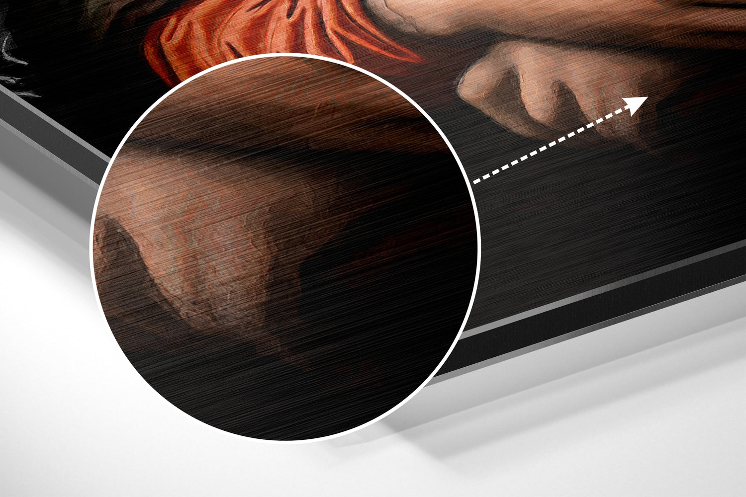 Close-up detail of brushed aluminum surface showing wood grain texture and reddish-brown tones with magnification circle highlighting the material finish.