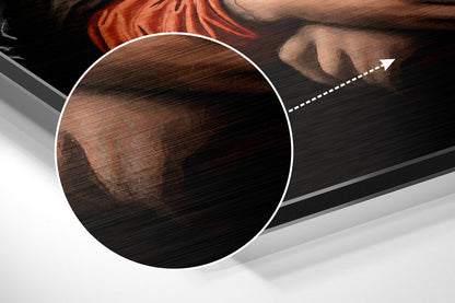 Close-up detail of brushed aluminum surface showing wood grain texture and reddish-brown tones with magnification circle highlighting the material finish.