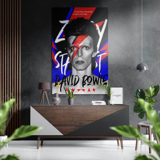 David Bowie portrait with red lightning bolt and blue geometric shapes mounted above mid-century wooden console in modern grey interior.