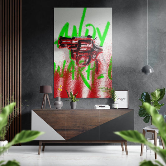 Modern living room interior with red revolver and green graffiti spray text wall art above wooden console table.