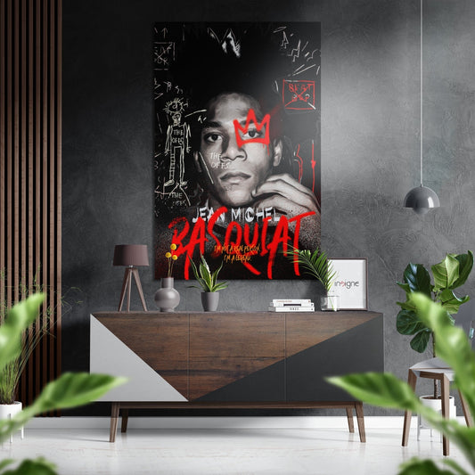 Modern interior scene featuring black and red Basquiat-style portrait with crown graphic mounted on gray wall above wooden console table.