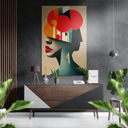 Modern interior styled with abstract portrait art featuring red circles and geometric shapes displayed above wooden dresser with plants and pendant lamp.