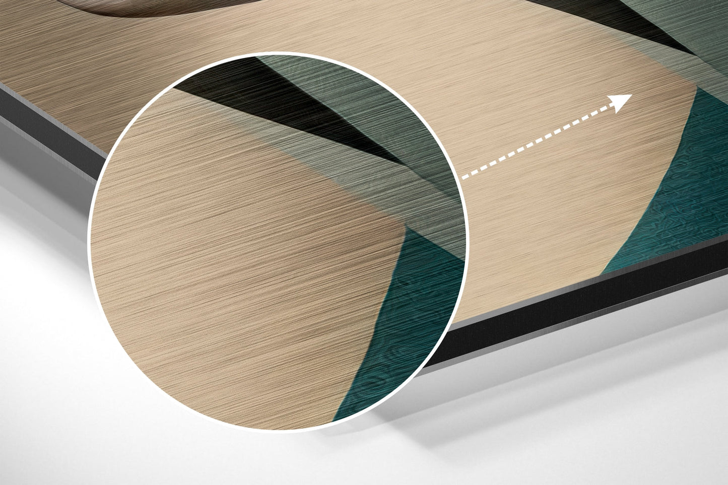 Close-up detail of brushed aluminum dibond wall art showing circular white frame with light wood and teal textured panels visible through magnified view.