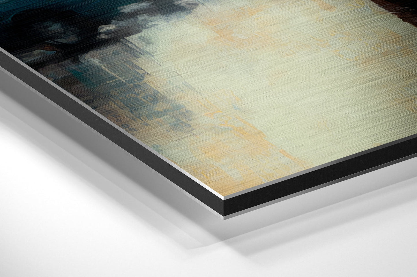 Close-up angled view of brushed aluminum Dibond print showing layered edge with black border and white backing board.