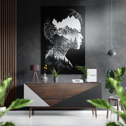 Black and white double-exposure portrait artwork hanging above wooden console table in modern interior setting with plants and pendant light.