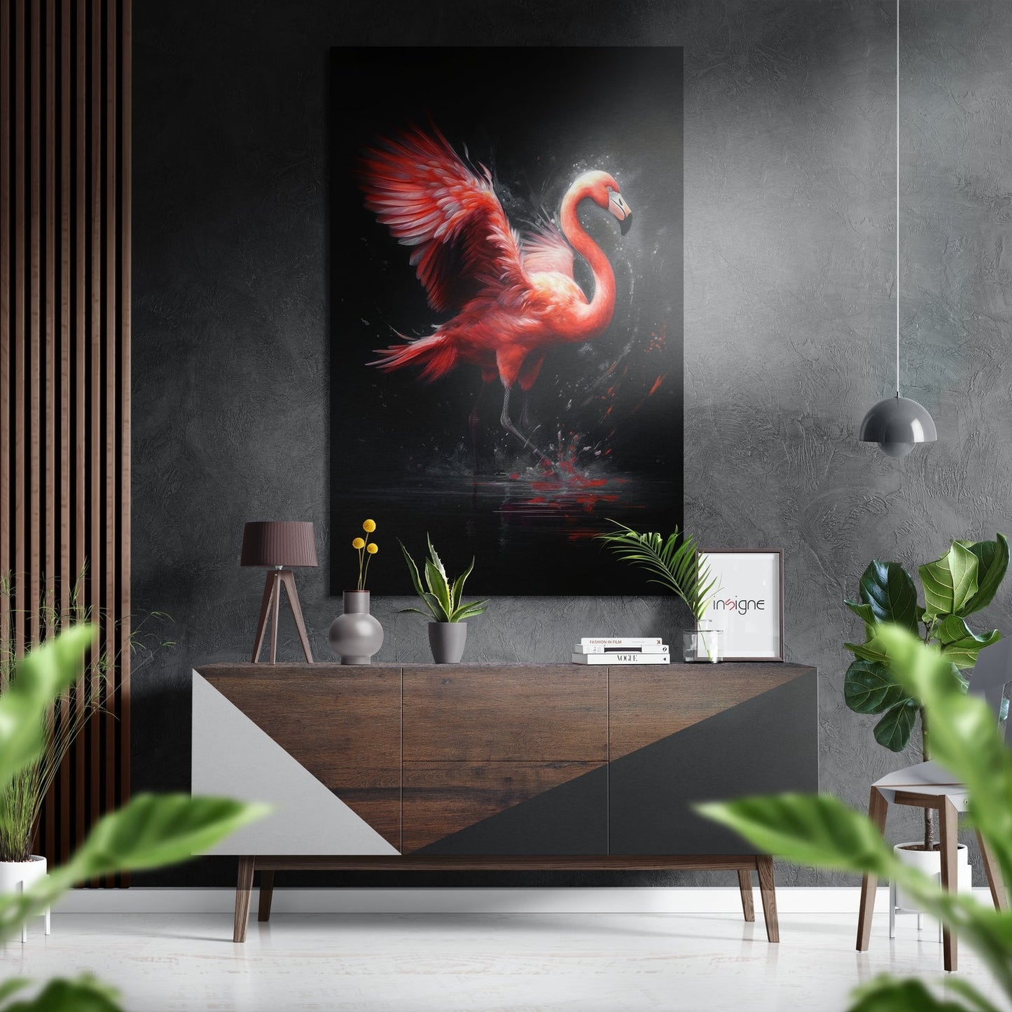 Red and orange flamingo wall art displayed above wooden console table in modern interior with plants and pendant lighting.