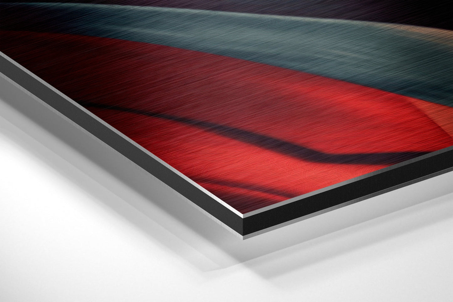 Close-up angled view of Jazz Brushed Aluminum Dibond wall art showing red, teal, and black layered materials with white backing.