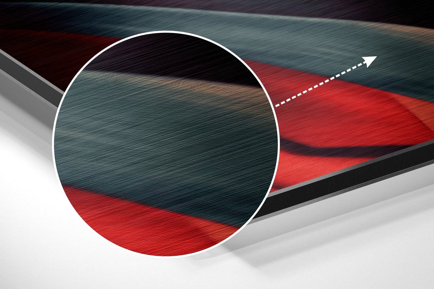 Close-up cross-section view of brushed aluminum wall art showing layered teal, red, black, and white geometric design with directional arrow detail.