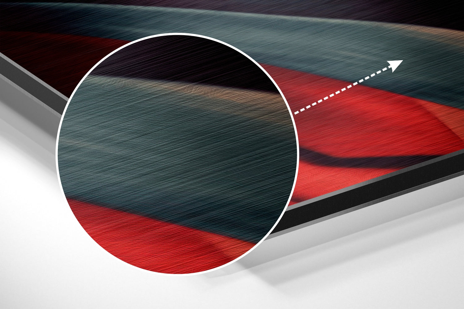 Close-up cross-section view of brushed aluminum wall art showing layered teal, red, black, and white geometric design with directional arrow detail.