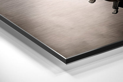 Close-up angled view of brushed aluminum Dibond panel edges showing layered construction with gray and black borders against white background.