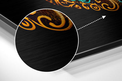 Gold and black skull design on brushed aluminum sheet displayed at diagonal angle against white background.