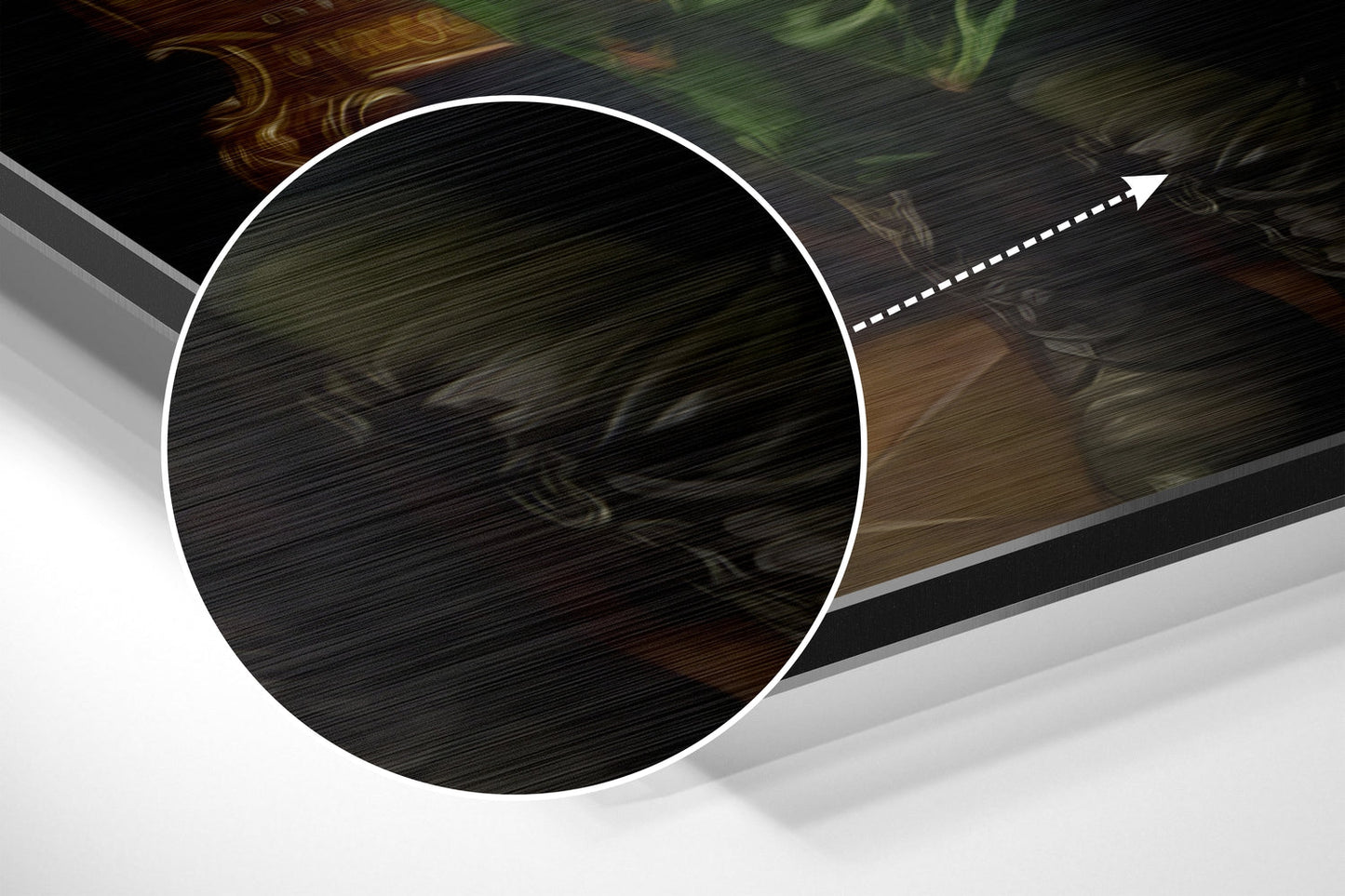 Close-up detail of brushed aluminum surface with circular white border and directional arrow indicator on dark textured background.