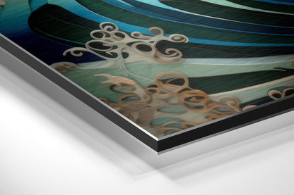 Close-up angled view of layered aluminum dibond print showing turquoise waves, tan octopus figures, and black frame edge.