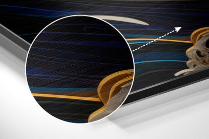 Cross-section close-up of aluminum dibond sheet showing layered interior with blue, black, and gold striped patterns and wavy design element.