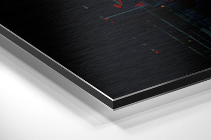 Close-up angled view of brushed aluminum Dibond panel edge showing black brushed surface with colored light reflections and white layered backing material.