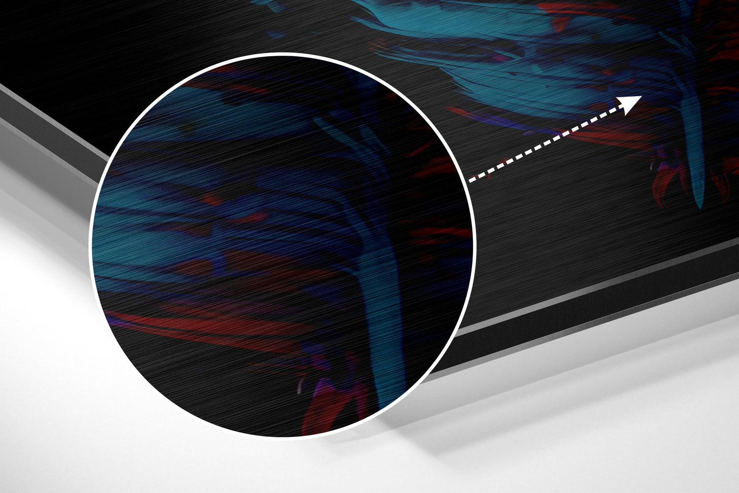 Close-up angled view of circular brushed aluminum wall art with blue and red streaked abstract pattern and white border outline.