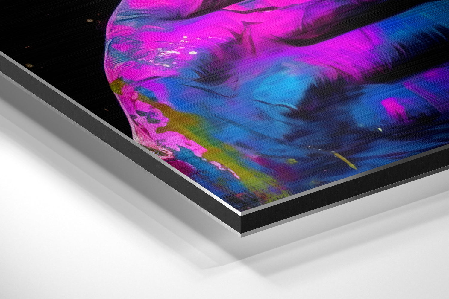 Angled product shot of vibrant magenta and blue brushed aluminum wall art with layered mounting system visible against white background.