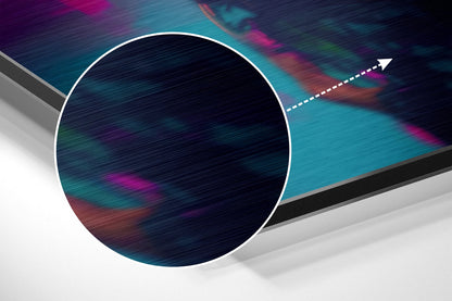 Abstract angled view of circular brushed aluminum wall art with colorful streaked texture and directional arrow graphic against geometric background.