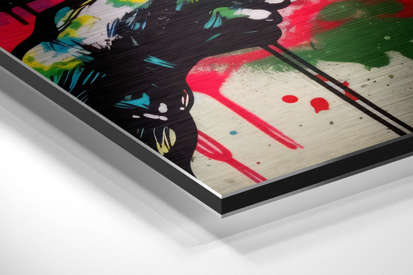 Angled perspective of framed wall art showing vibrant graffiti-style design with black cat face, red and green paint strokes on light wood texture, mounted in black aluminum frame.