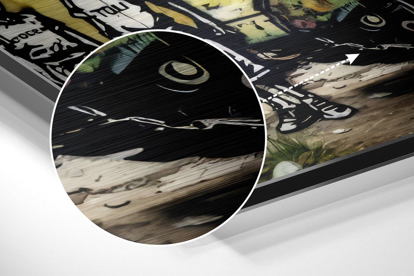 Close-up detail of brushed aluminum surface showing wood texture and black printed graphics with circular magnified inset.