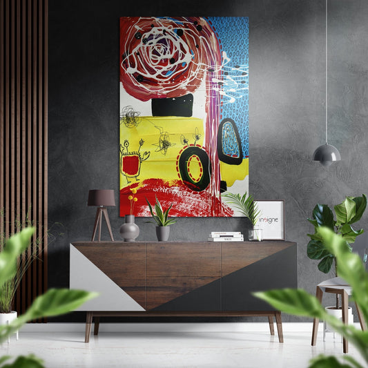 Modern living room interior featuring colorful abstract wall art with red spiral, yellow sections, and blue patterns above a wooden console table with plants and decor.