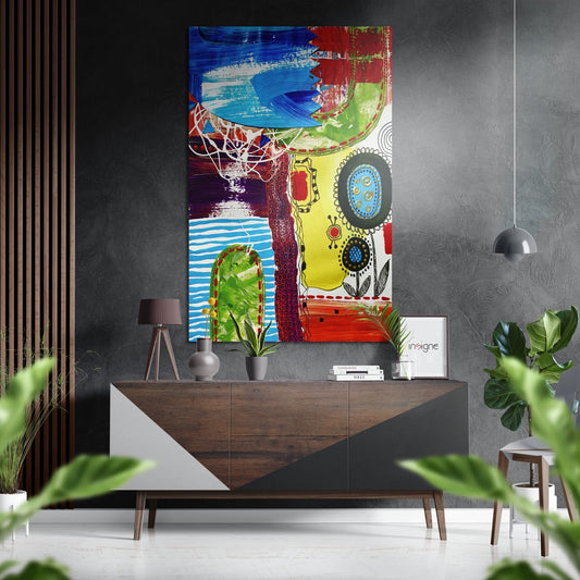 Colorful abstract Kandinsky-style wall art featuring blue arches, red flowers, and geometric circles displayed above a wooden dresser in a modern interior.