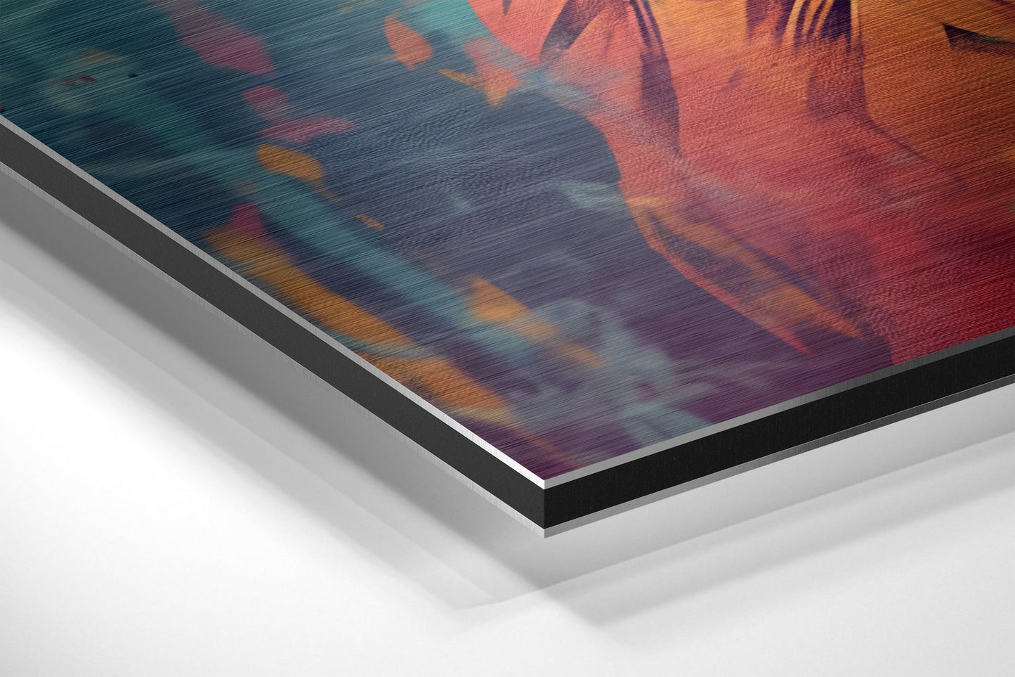 Close-up angled view of layered brushed aluminum and black frame edges of colorful lion artwork with warm orange and cool teal tones.