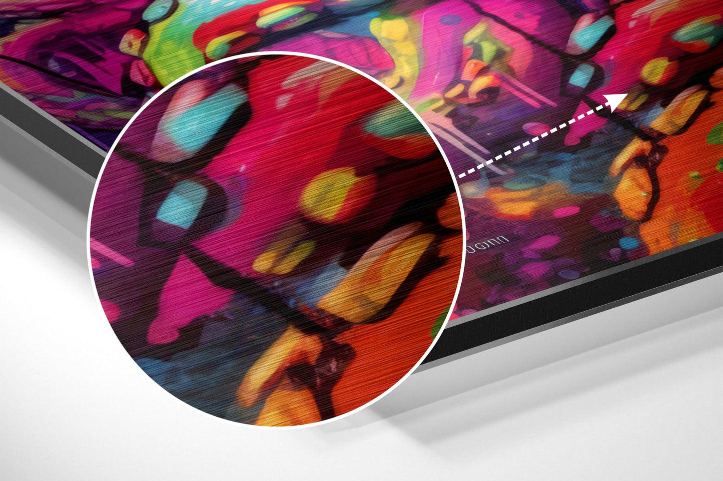 Angled close-up detail of colorful DJ Octopus brushed aluminum wall art showing vibrant magenta, red, orange, yellow, and cyan abstract design with motion blur effect.