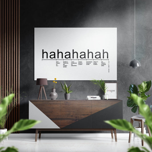 Modern living room featuring white laughter scale typography art above wooden dresser with plants and decor.