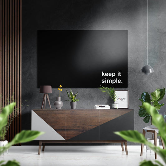 Modern living room with black TV displaying "keep it simple" text above wooden console table with plants and pendant lamp.