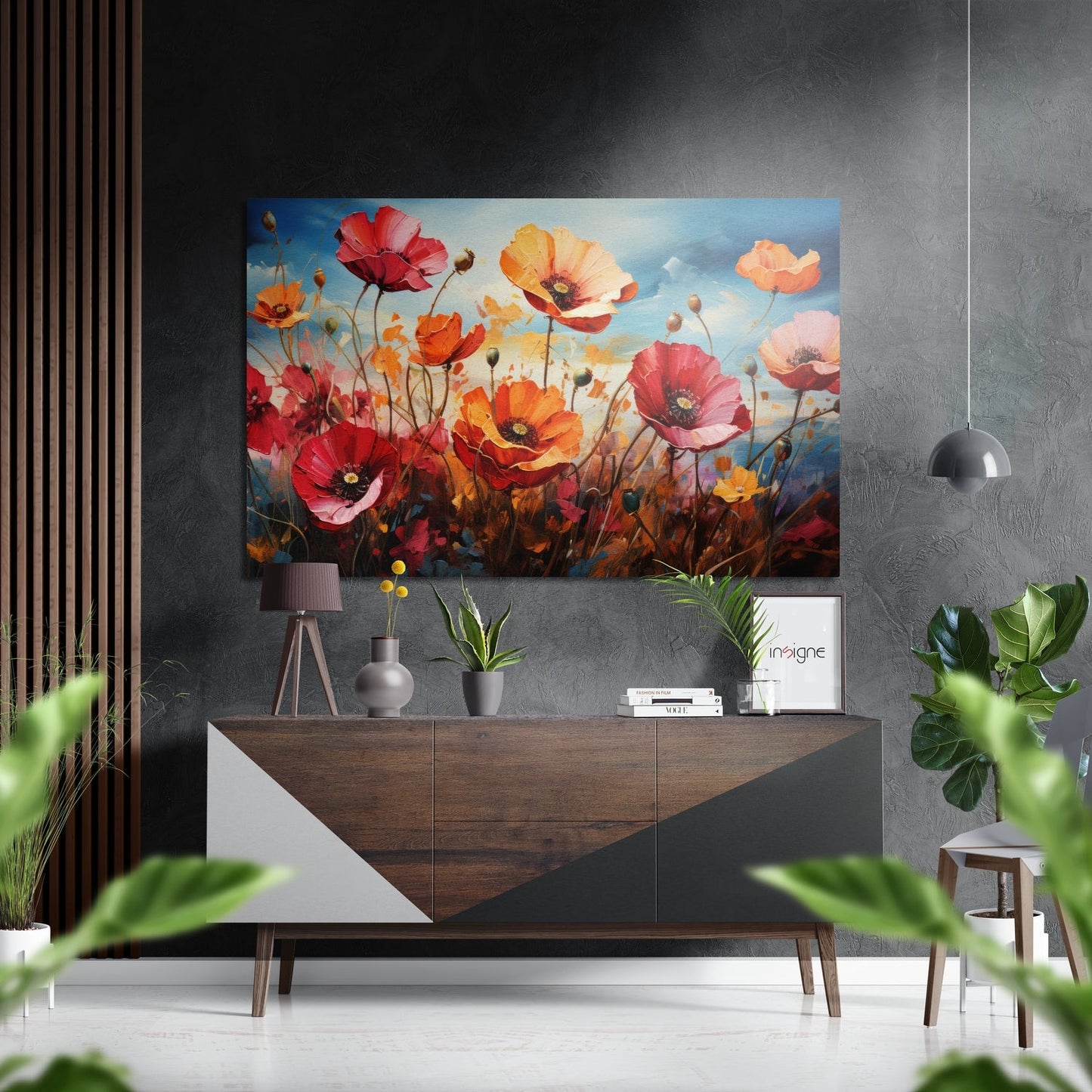Vibrant poppy artwork displayed above a wooden dresser in a modern grey interior with potted plants and pendant lighting.