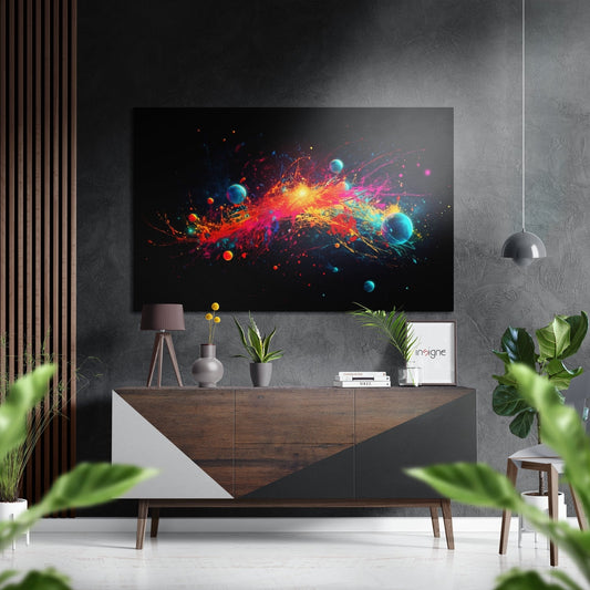 Modern living room with colorful abstract paint splash and planets artwork displayed above wooden console table with decor and plants.