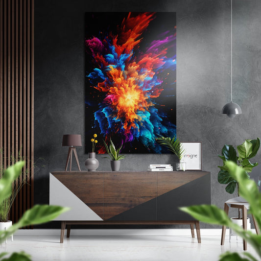 Vibrant multicolored powder explosion artwork displayed above wooden console in modern living room with plants and pendant light.