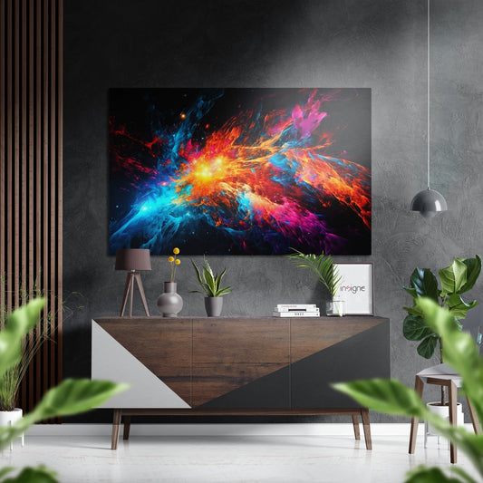 Vibrant abstract color blast artwork displayed on gray wall above wooden console with plants and decor.