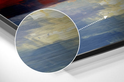 Close-up detail of brushed aluminum surface showing horizontal grain texture in blue and gold tones with magnified circular overlay.