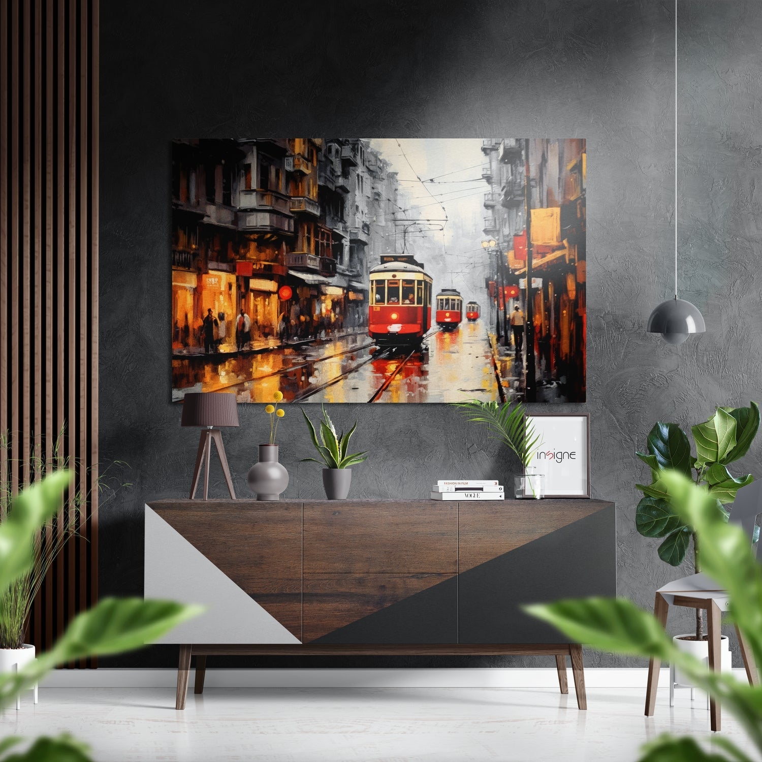 Red and yellow tram traveling through wet rainy city street with golden-lit buildings, displayed as wall art above wooden dresser.