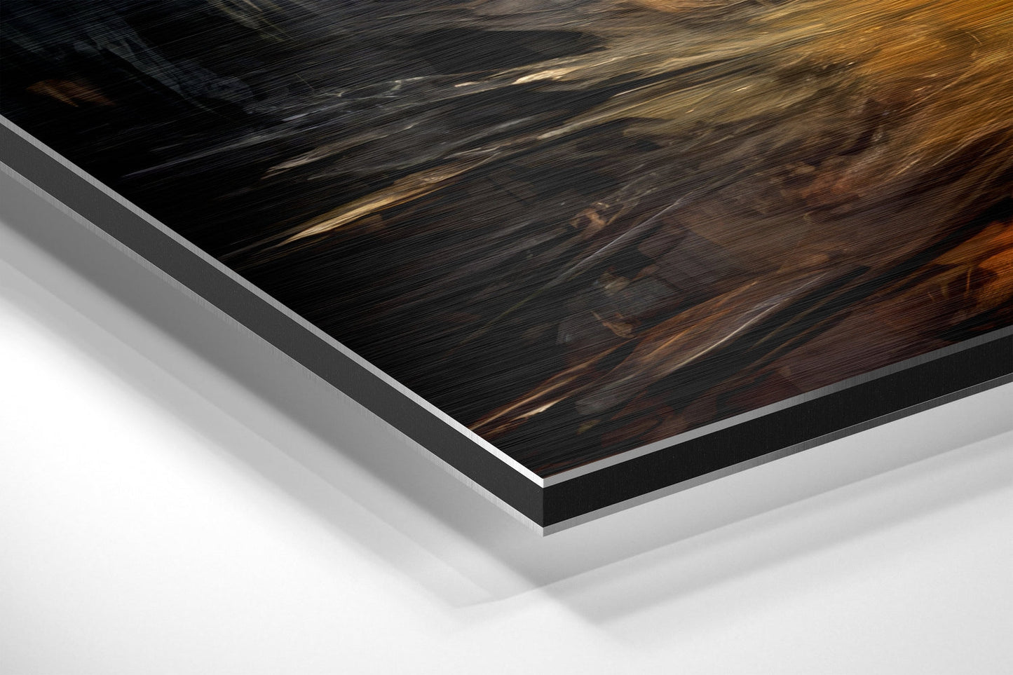Close-up angled view of layered Dibond wall art showing dark wood grain surface with metallic silver edges and white backing material.